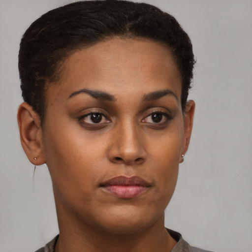 Neutral black young-adult female with short  brown hair and brown eyes