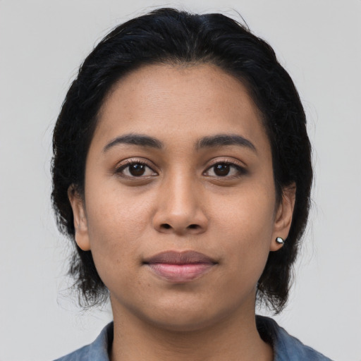 Neutral latino young-adult female with medium  black hair and brown eyes