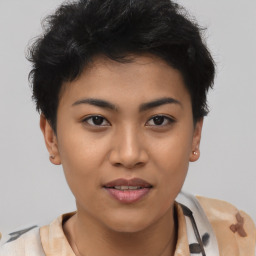 Joyful asian young-adult female with short  black hair and brown eyes