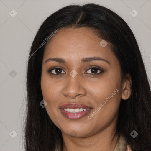 Joyful black young-adult female with long  brown hair and brown eyes