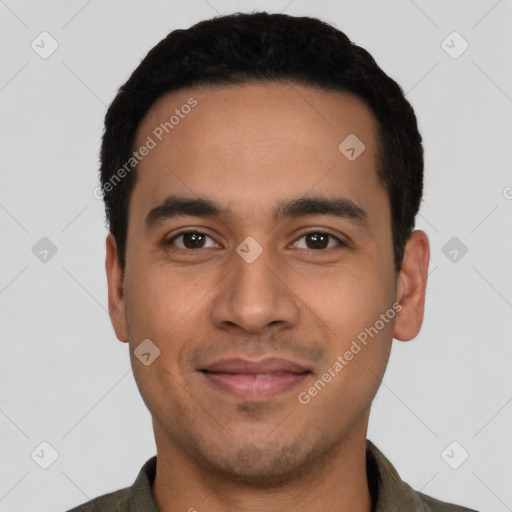 Joyful latino young-adult male with short  black hair and brown eyes