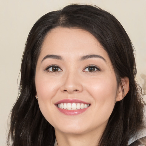 Joyful white young-adult female with long  black hair and brown eyes