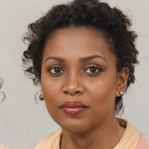 Neutral black young-adult female with medium  brown hair and brown eyes