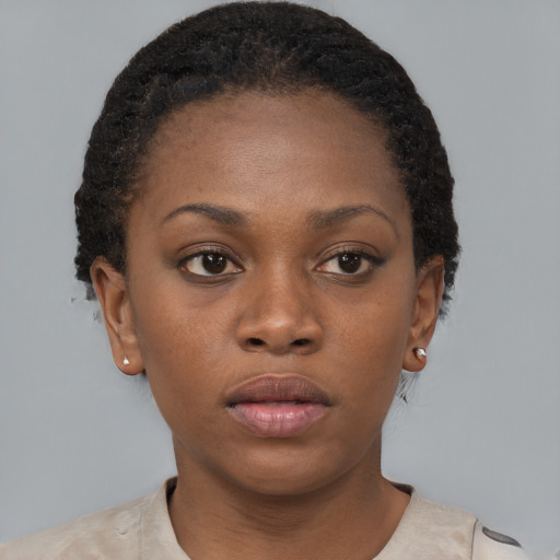 Neutral black young-adult female with short  brown hair and brown eyes