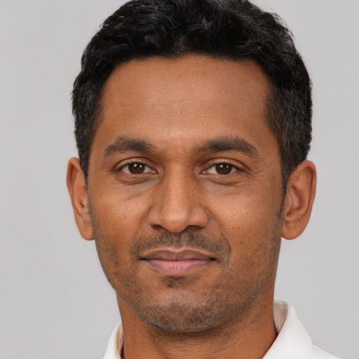 Neutral latino adult male with short  black hair and brown eyes