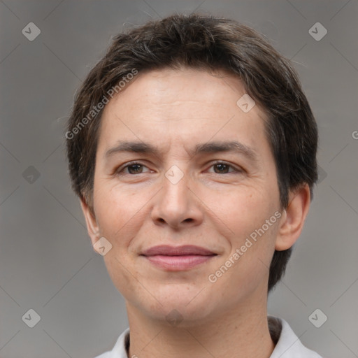 Joyful white adult female with short  brown hair and brown eyes