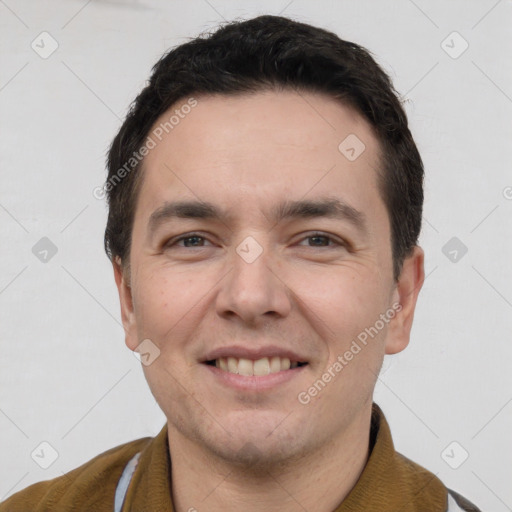 Joyful white young-adult male with short  brown hair and brown eyes