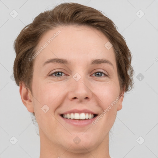 Joyful white young-adult female with short  brown hair and grey eyes