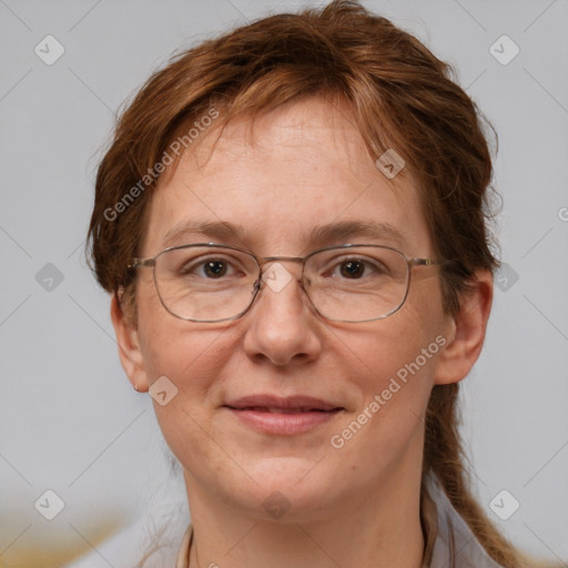 Joyful white adult female with medium  brown hair and grey eyes