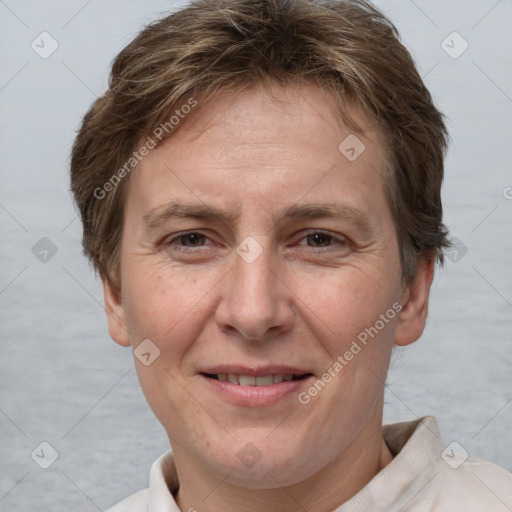 Joyful white adult female with short  brown hair and brown eyes