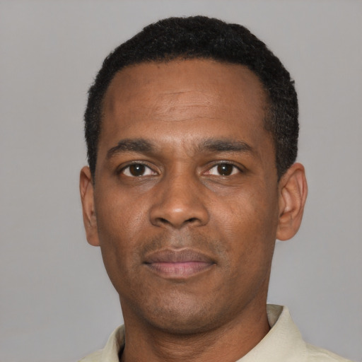 Neutral black young-adult male with short  black hair and brown eyes