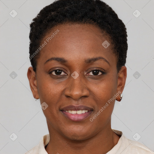 Joyful black young-adult female with short  black hair and brown eyes