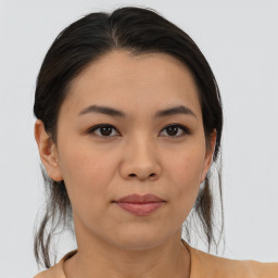 Joyful asian young-adult female with medium  black hair and brown eyes