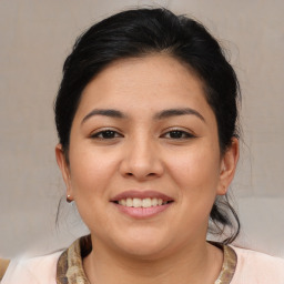 Joyful white young-adult female with medium  brown hair and brown eyes