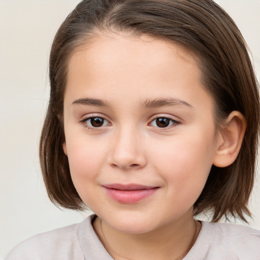 Joyful white child female with medium  brown hair and brown eyes