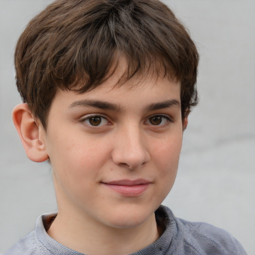 Joyful white child male with short  brown hair and brown eyes