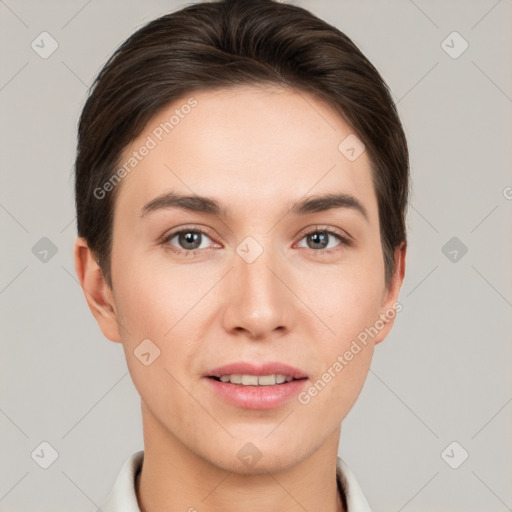 Joyful white young-adult female with short  brown hair and grey eyes