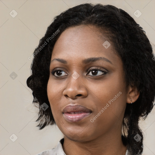 Joyful black young-adult female with medium  black hair and brown eyes