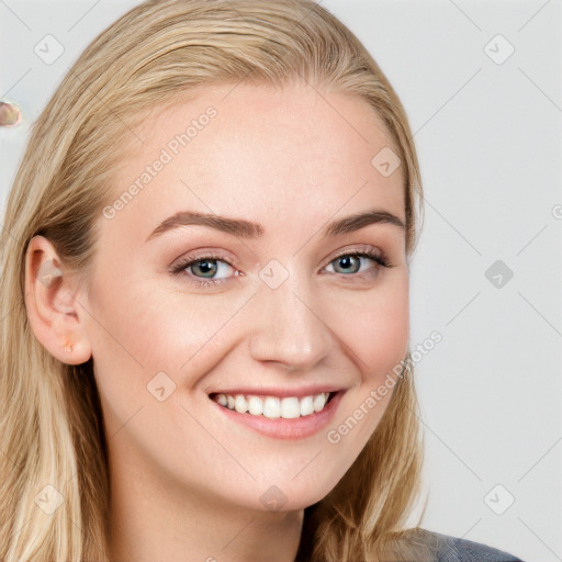 Joyful white young-adult female with long  brown hair and blue eyes