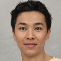 Joyful asian young-adult male with short  brown hair and brown eyes