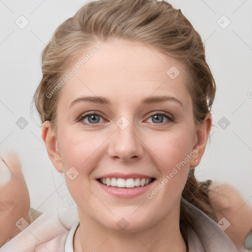 Joyful white young-adult female with medium  brown hair and blue eyes