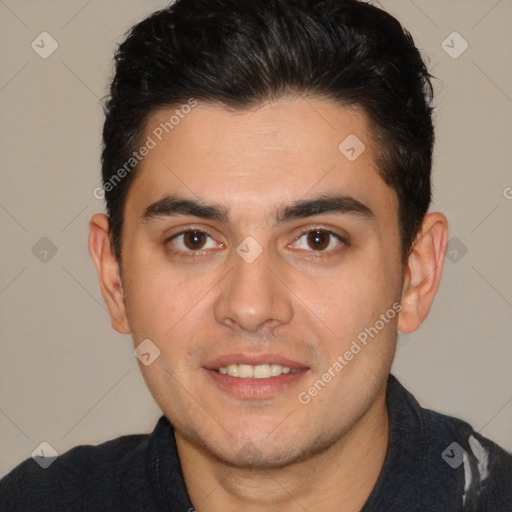 Joyful white young-adult male with short  black hair and brown eyes