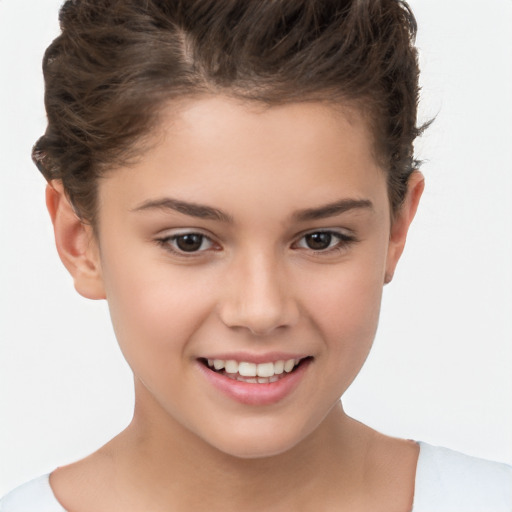 Joyful white child female with short  brown hair and brown eyes