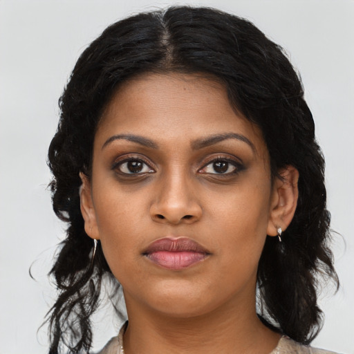 Neutral black young-adult female with long  brown hair and brown eyes