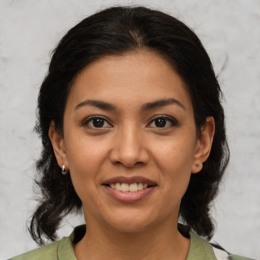 Joyful asian young-adult female with medium  brown hair and brown eyes