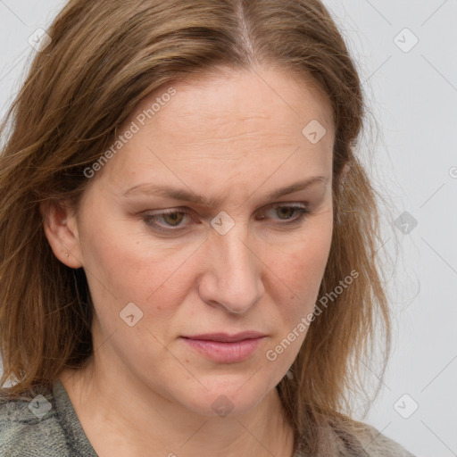 Joyful white adult female with medium  brown hair and grey eyes