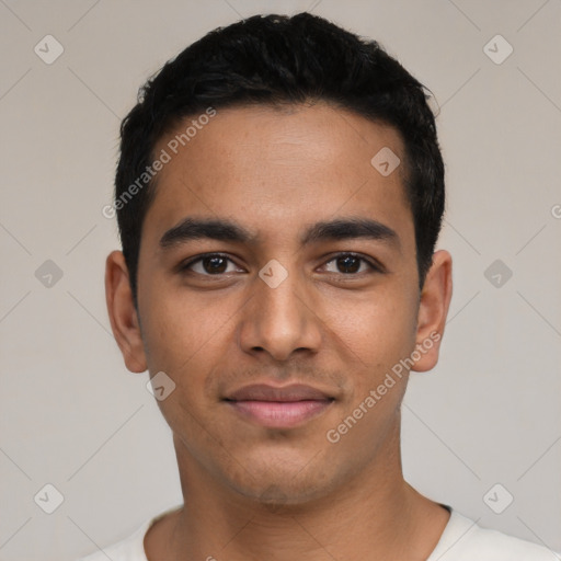 Joyful latino young-adult male with short  black hair and brown eyes