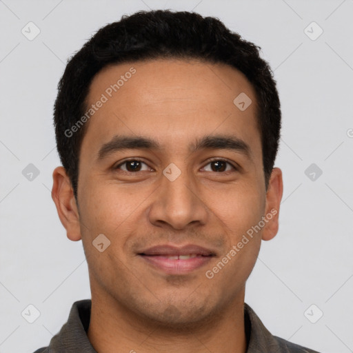 Joyful latino young-adult male with short  brown hair and brown eyes