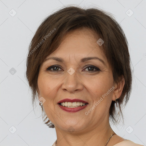 Joyful white adult female with medium  brown hair and brown eyes