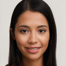 Joyful latino young-adult female with long  black hair and brown eyes