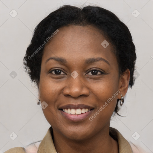 Joyful black young-adult female with medium  brown hair and brown eyes