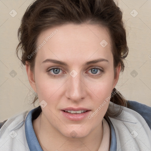 Joyful white young-adult female with short  brown hair and blue eyes