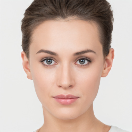 Neutral white young-adult female with short  brown hair and brown eyes