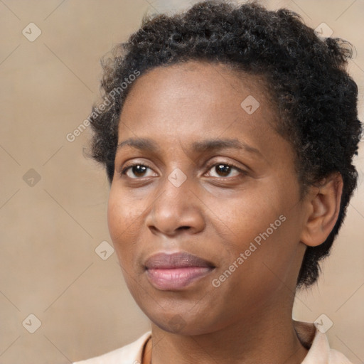 Joyful black adult female with short  brown hair and brown eyes