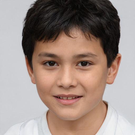Joyful white child male with short  brown hair and brown eyes