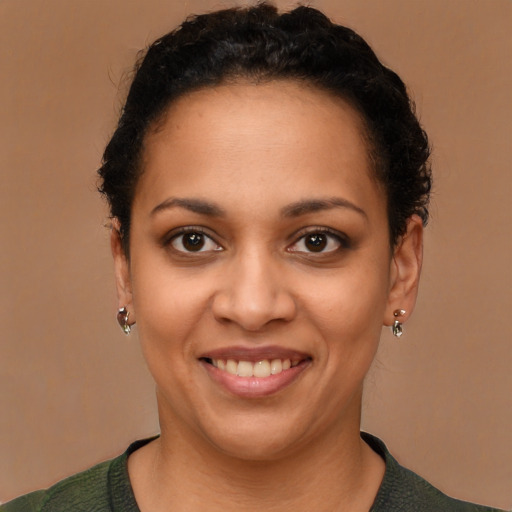 Joyful latino young-adult female with short  brown hair and brown eyes