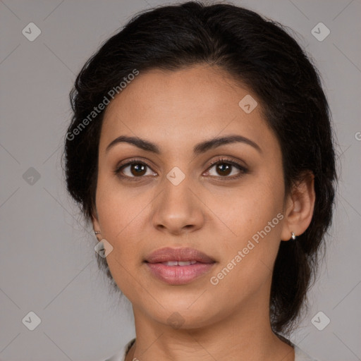 Joyful latino young-adult female with medium  brown hair and brown eyes