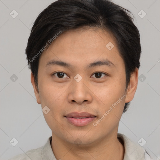 Joyful asian young-adult male with short  brown hair and brown eyes