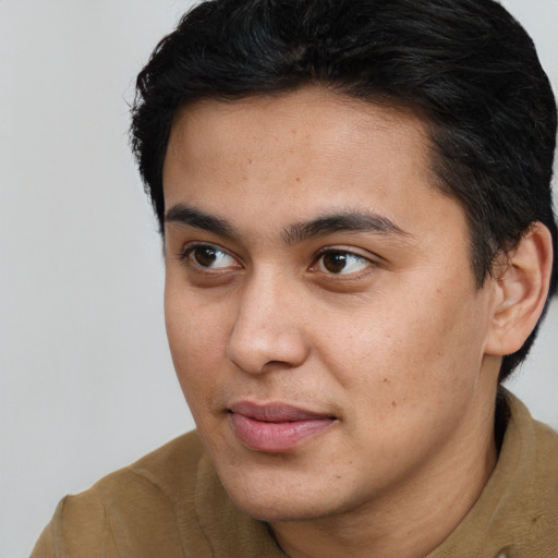 Joyful asian young-adult male with short  brown hair and brown eyes