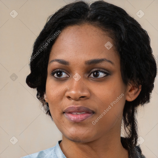 Joyful black young-adult female with medium  black hair and brown eyes