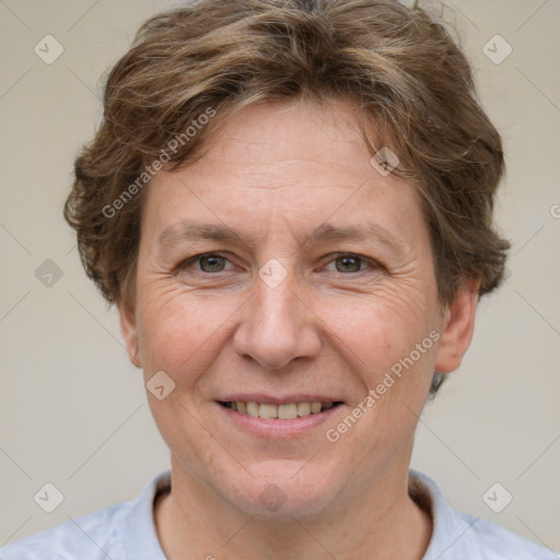 Joyful white adult female with short  brown hair and brown eyes