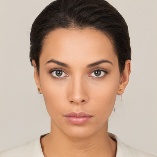 Neutral latino young-adult female with short  black hair and brown eyes