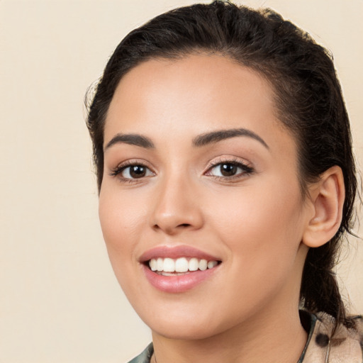 Joyful white young-adult female with long  brown hair and brown eyes