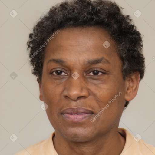 Joyful black adult male with short  brown hair and brown eyes