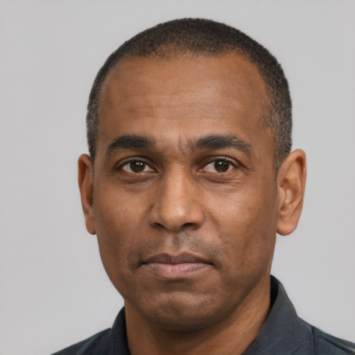 Neutral latino adult male with short  black hair and brown eyes