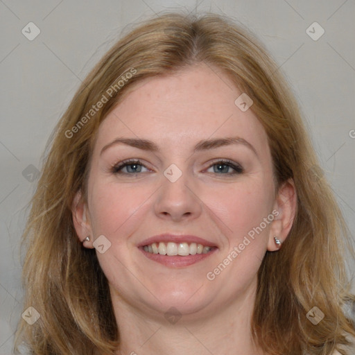 Joyful white young-adult female with medium  brown hair and blue eyes